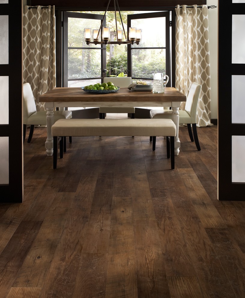 Traditional dining room in Detroit with vinyl flooring.