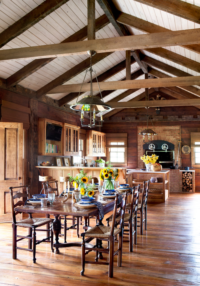 Example of a cottage medium tone wood floor kitchen/dining room combo design in Atlanta