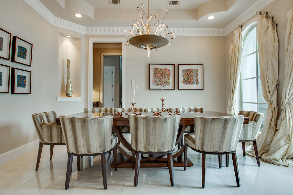 This is an example of a mediterranean dining room in Dallas with beige walls.