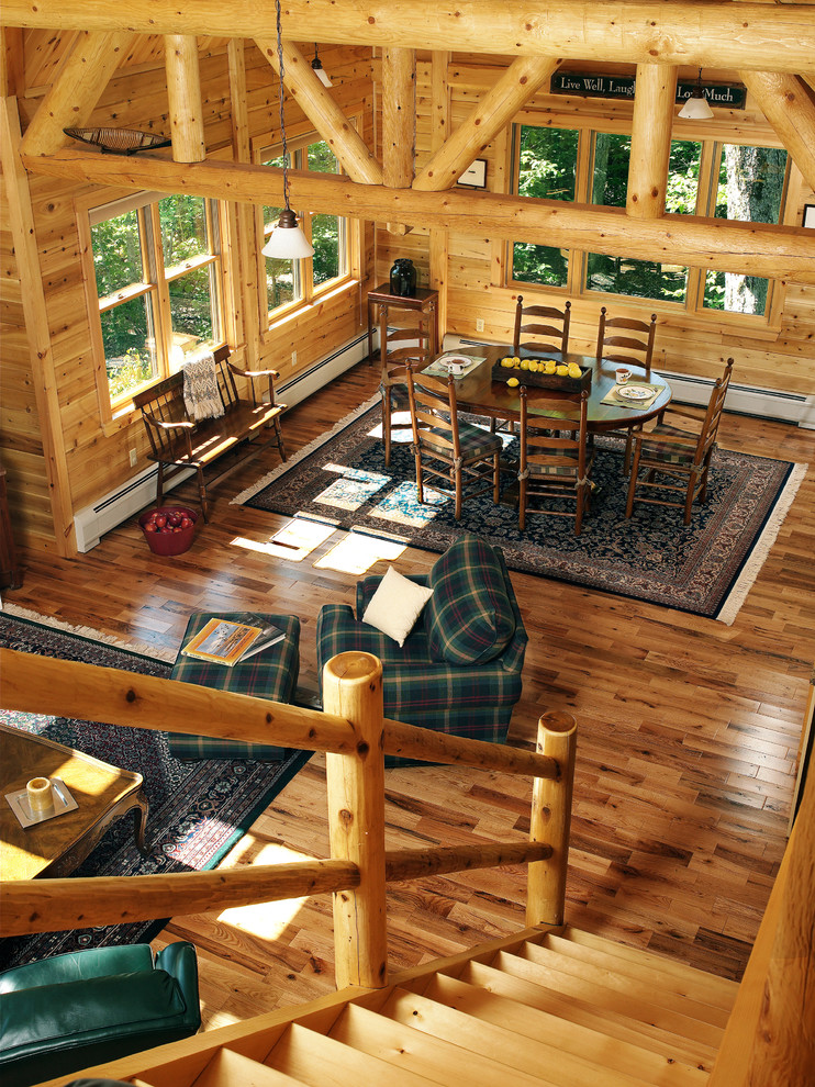 Design ideas for a medium sized rustic dining room in Portland Maine with dark hardwood flooring.