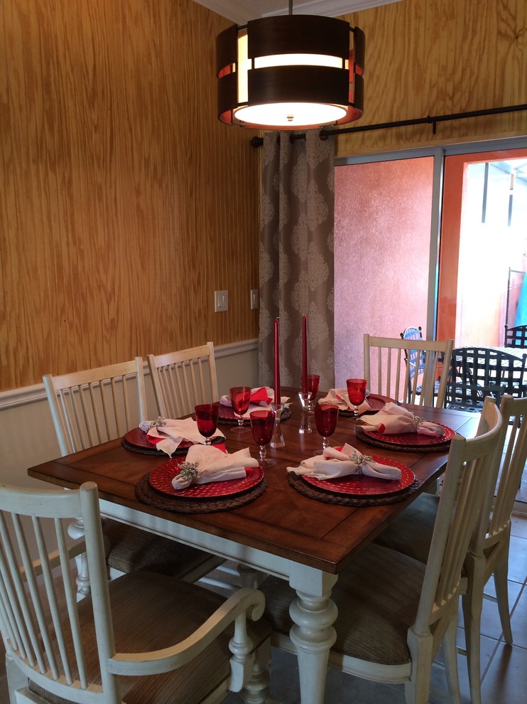 Inspiration for a small rustic ceramic tile enclosed dining room remodel in Orlando