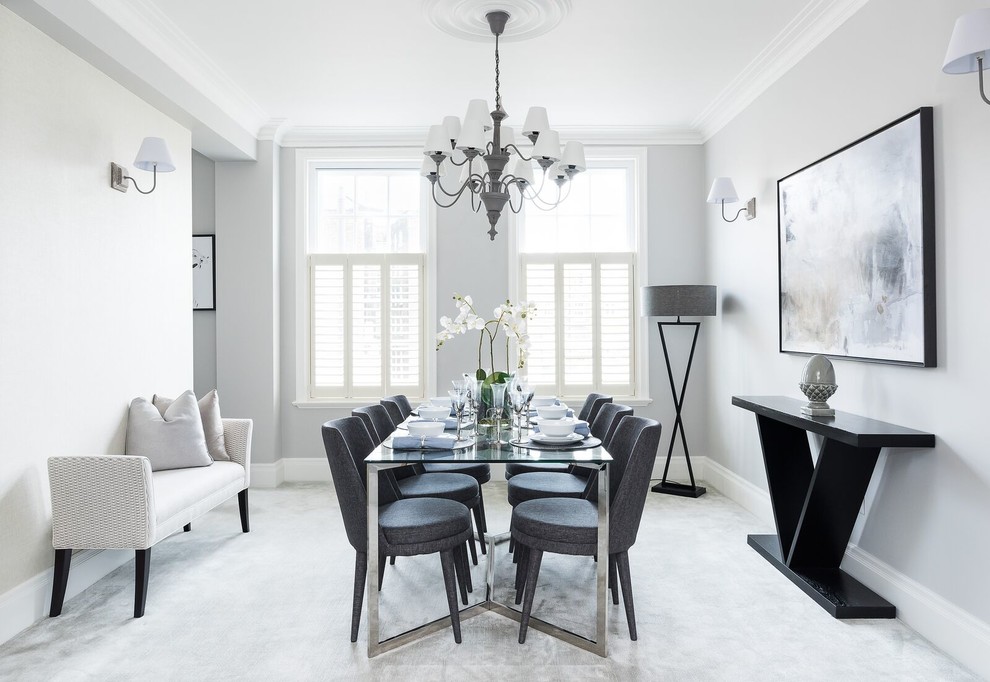 This is an example of a medium sized classic dining room in London with grey walls, carpet, grey floors, no fireplace and feature lighting.