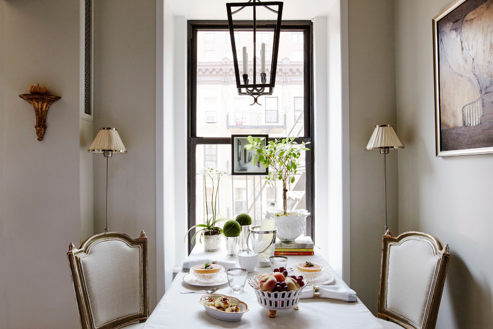 Inspiration for a classic dining room in New York with beige walls.