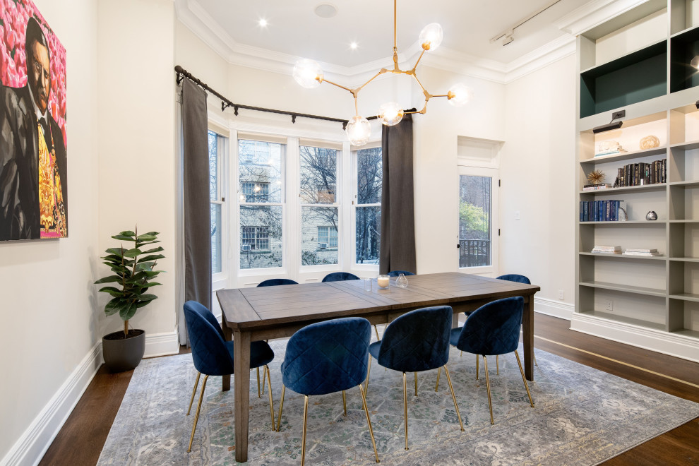 This is an example of a medium sized contemporary open plan dining room in New York with white walls, dark hardwood flooring and brown floors.