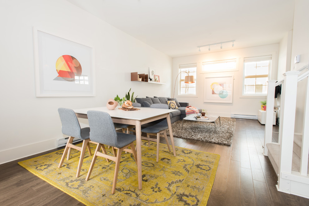 Inspiration for a medium sized scandinavian open plan dining room in Vancouver with white walls, no fireplace and brown floors.