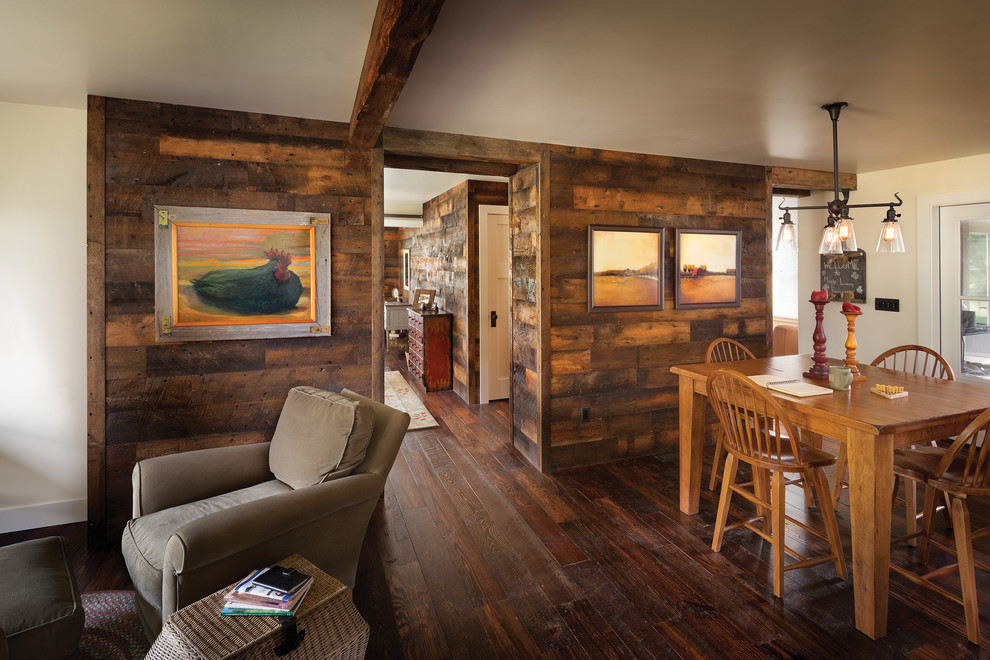 Example of a farmhouse dark wood floor dining room design in Other with beige walls