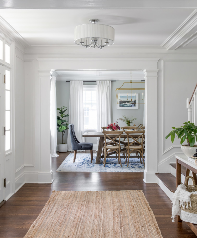 Inspiration for a large classic dining room in New York with grey walls, medium hardwood flooring and a coffered ceiling.