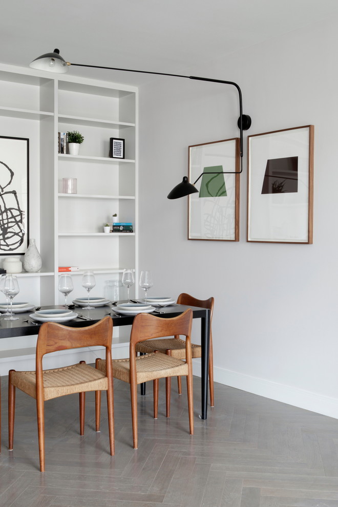 Источник вдохновения для домашнего уюта: столовая среднего размера в стиле модернизм с белыми стенами и серым полом