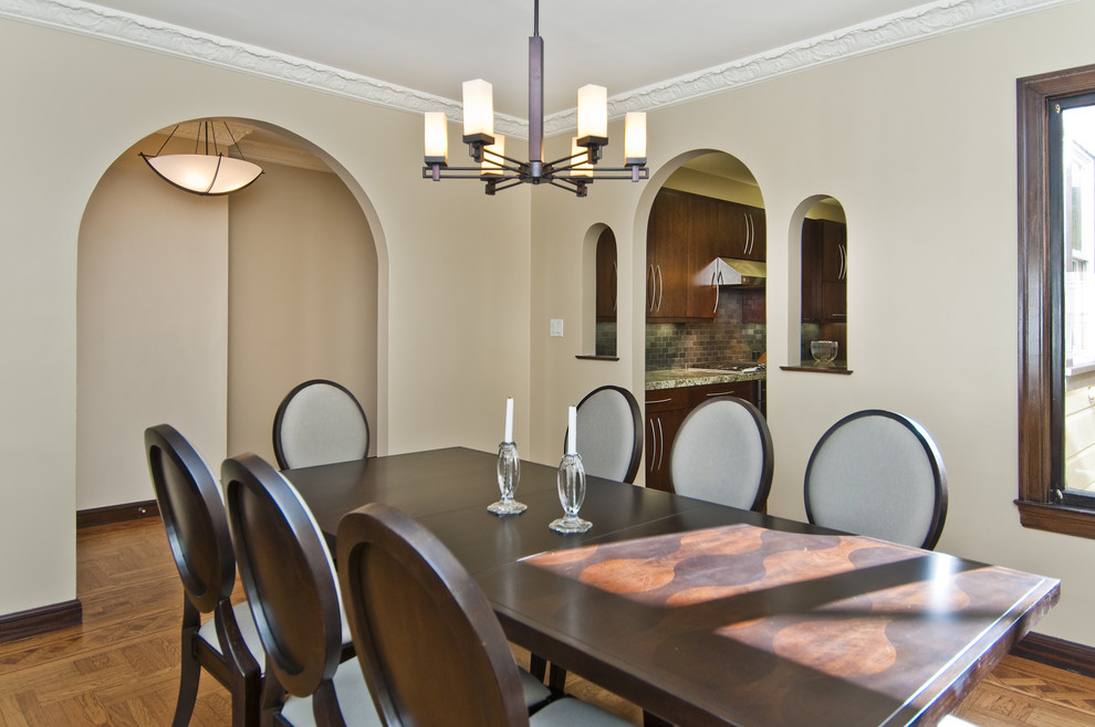 Inspiration for a transitional medium tone wood floor enclosed dining room remodel in San Francisco with beige walls