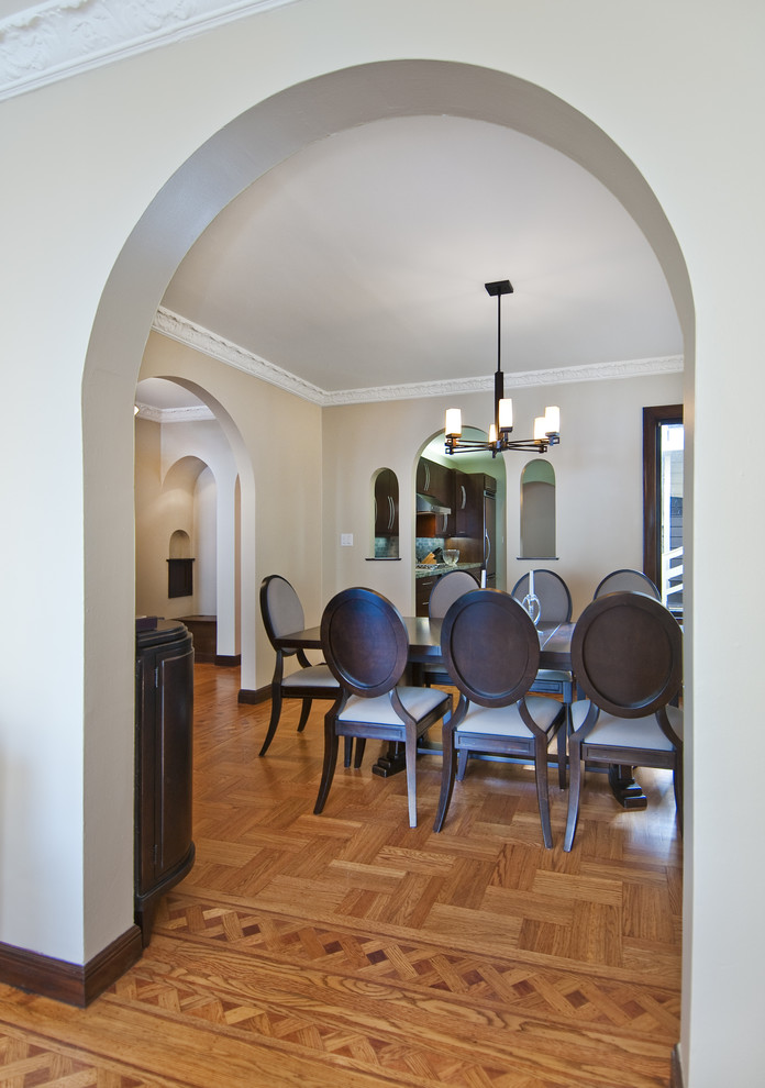 Design ideas for a classic enclosed dining room in San Francisco with beige walls and medium hardwood flooring.
