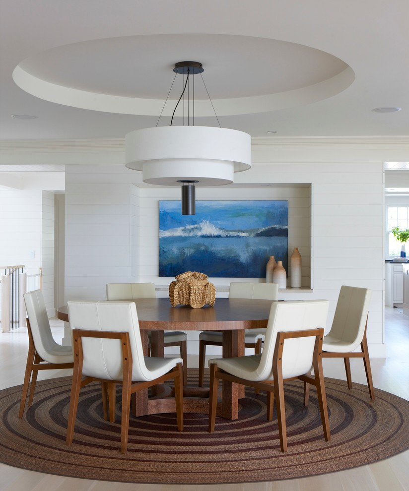 Mid-sized beach style light wood floor and beige floor dining room photo in Boston with white walls and no fireplace