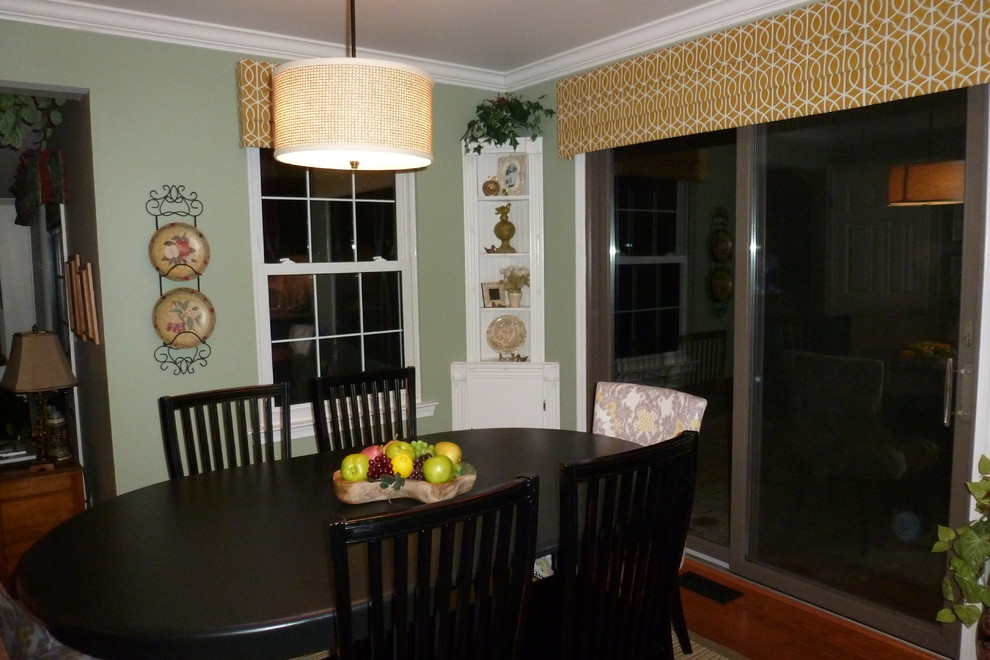 Photo of a medium sized traditional kitchen/dining room in Philadelphia with green walls, medium hardwood flooring and no fireplace.