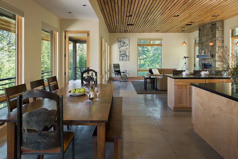 Источник вдохновения для домашнего уюта: кухня-столовая в стиле модернизм с белыми стенами и бетонным полом