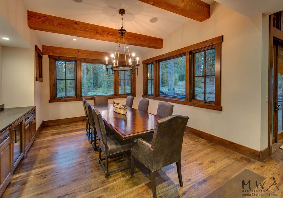 Inspiration for a mid-sized craftsman medium tone wood floor and brown floor enclosed dining room remodel in Other with beige walls