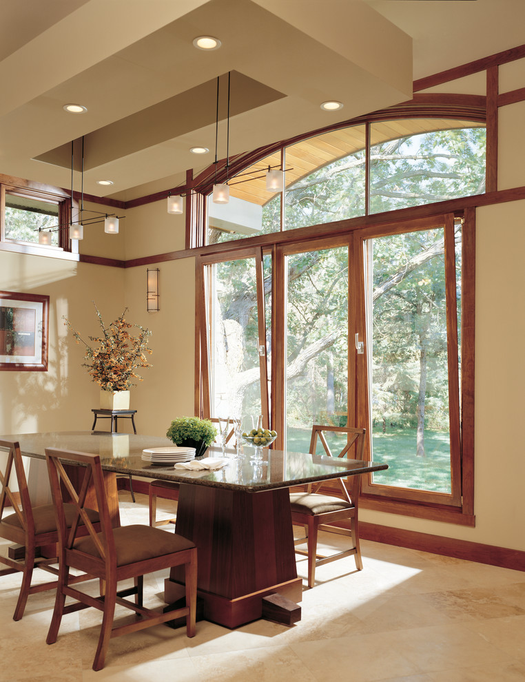 Example of an arts and crafts enclosed dining room design in Other with beige walls and no fireplace