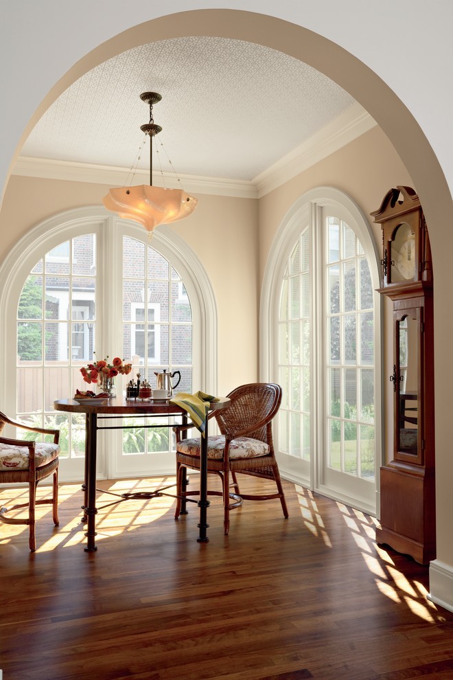 Inspiration for a timeless dining room remodel in Other with beige walls