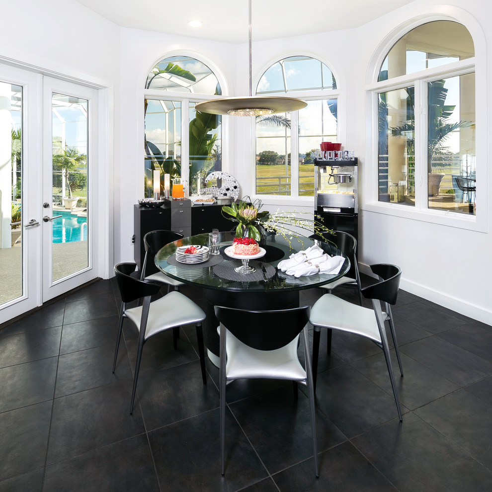 Transitional kitchen/dining room combo photo in Miami with white walls