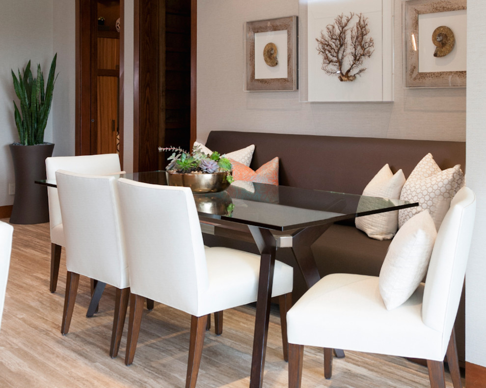 This is an example of a contemporary dining room in Orange County with beige walls, porcelain flooring and beige floors.