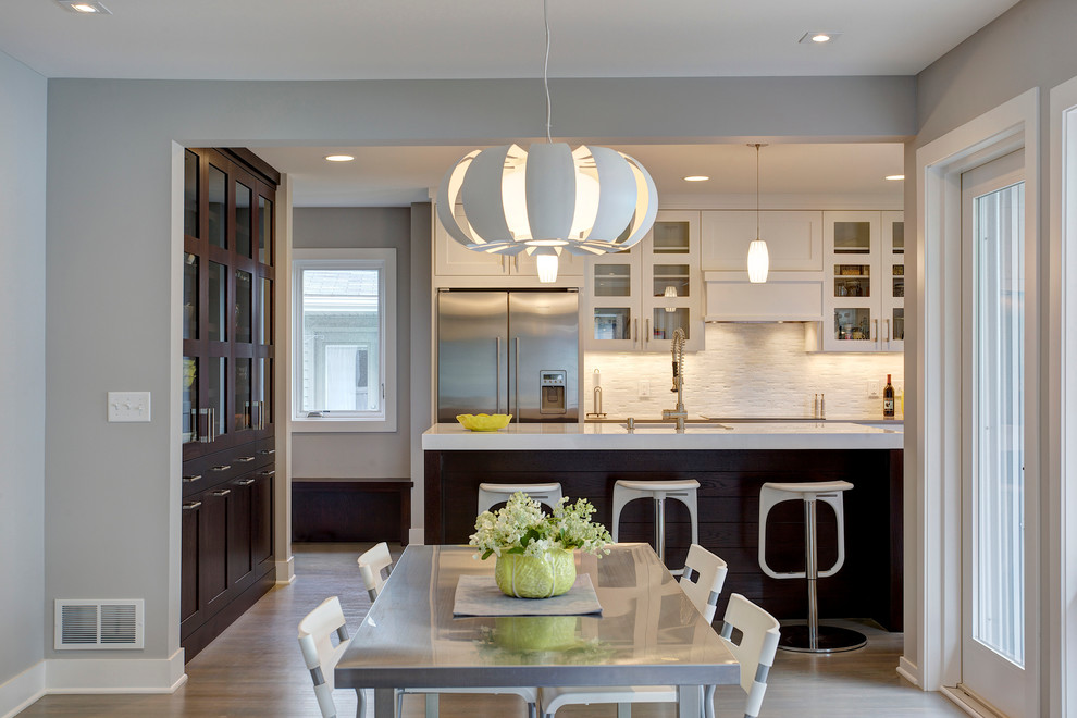 Photo of a medium sized contemporary kitchen/dining room in Minneapolis with medium hardwood flooring.
