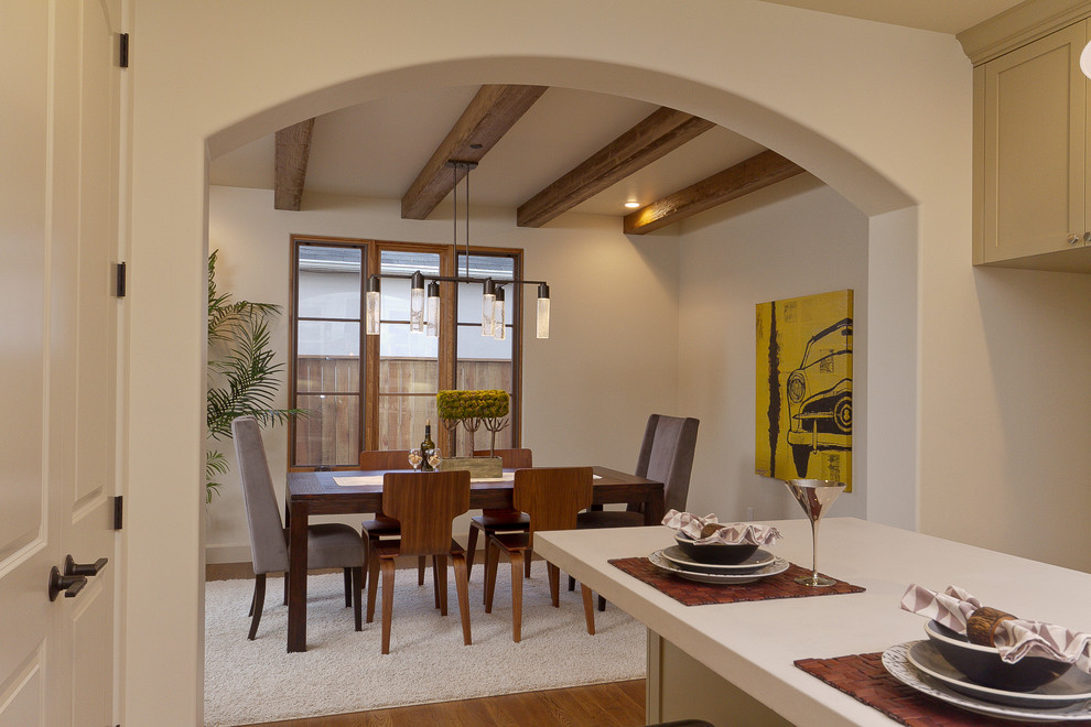 Photo of a mediterranean enclosed dining room in Sacramento with beige walls.