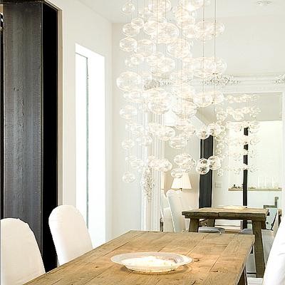 Photo of an eclectic dining room in San Francisco with white walls.