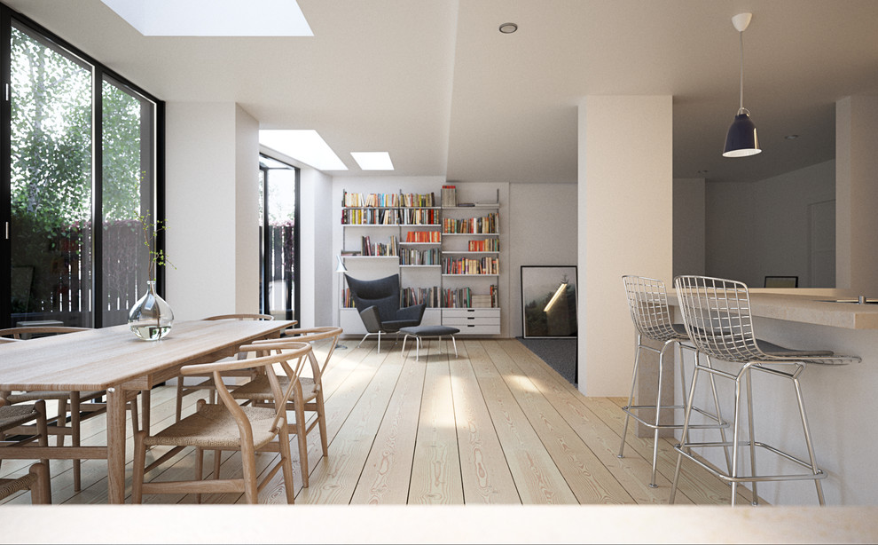 Great room - modern light wood floor great room idea in London with white walls