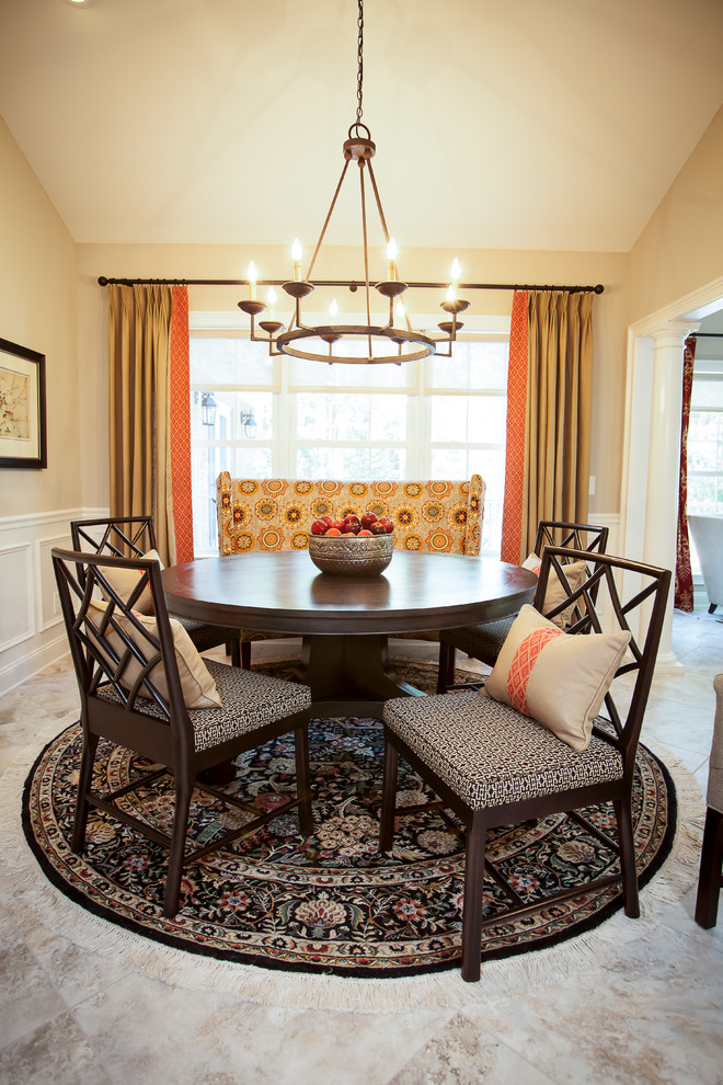 This is an example of a classic dining room in Atlanta with beige walls.