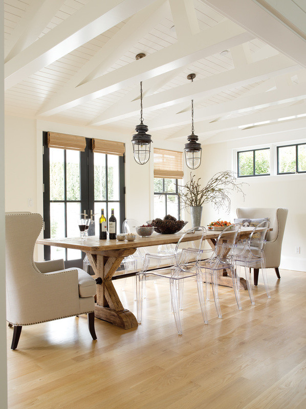 Medium sized farmhouse enclosed dining room in Seattle with white walls, light hardwood flooring, no fireplace and beige floors.