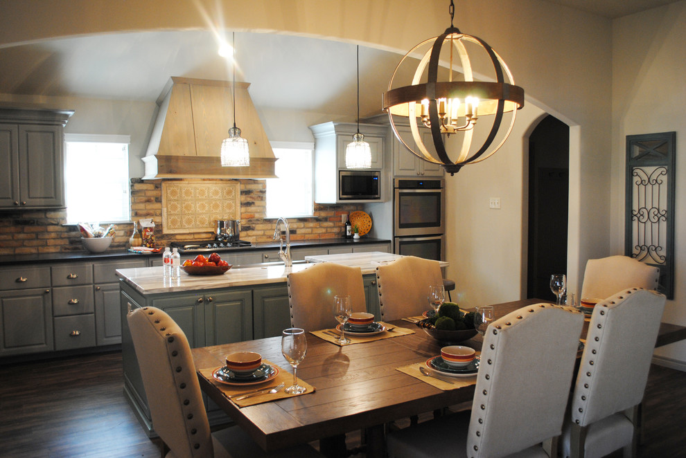 Medium sized mediterranean kitchen/dining room in Austin with beige walls, vinyl flooring and no fireplace.