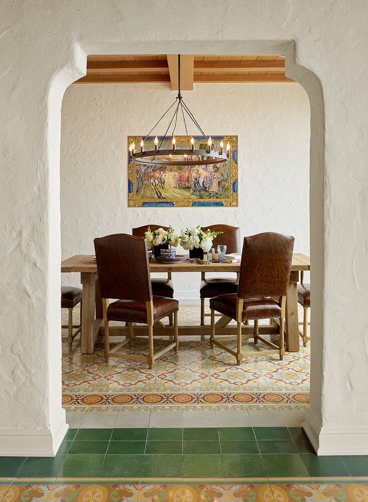 Inspiration for a mediterranean enclosed dining room in San Francisco with white walls and multi-coloured floors.