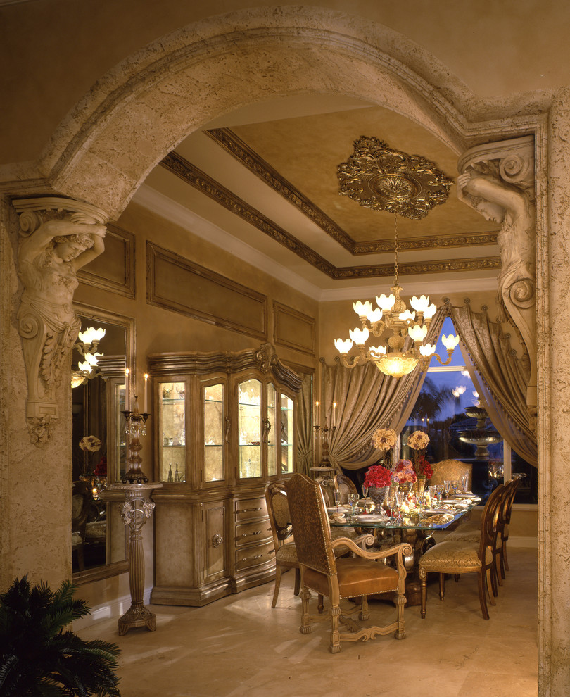 This is an example of a large mediterranean enclosed dining room in Miami with beige walls, travertine flooring, no fireplace and beige floors.