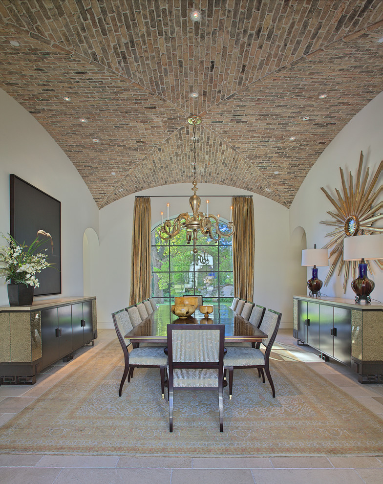 Example of a huge tuscan limestone floor dining room design in Dallas with white walls and no fireplace