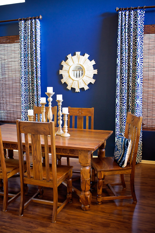 Inspiration for a mediterranean dining room remodel in Phoenix with blue walls