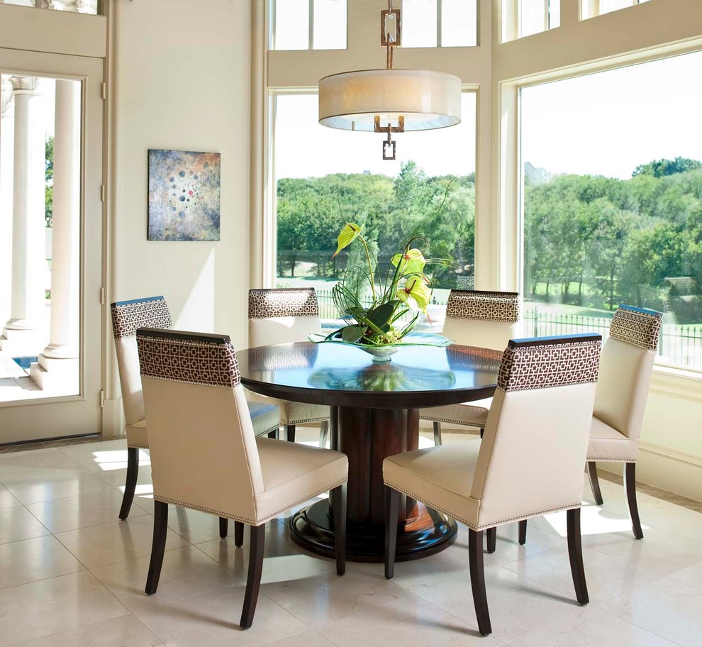 Mediterranean dining room in Dallas with white walls.