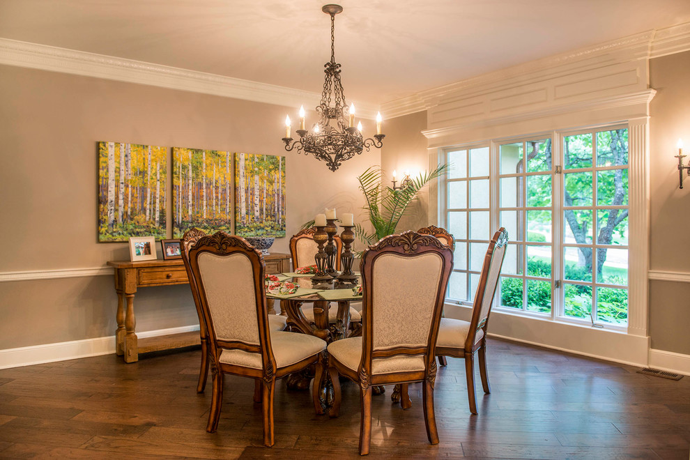 This is an example of a medium sized mediterranean enclosed dining room in Kansas City with beige walls, dark hardwood flooring, no fireplace and brown floors.