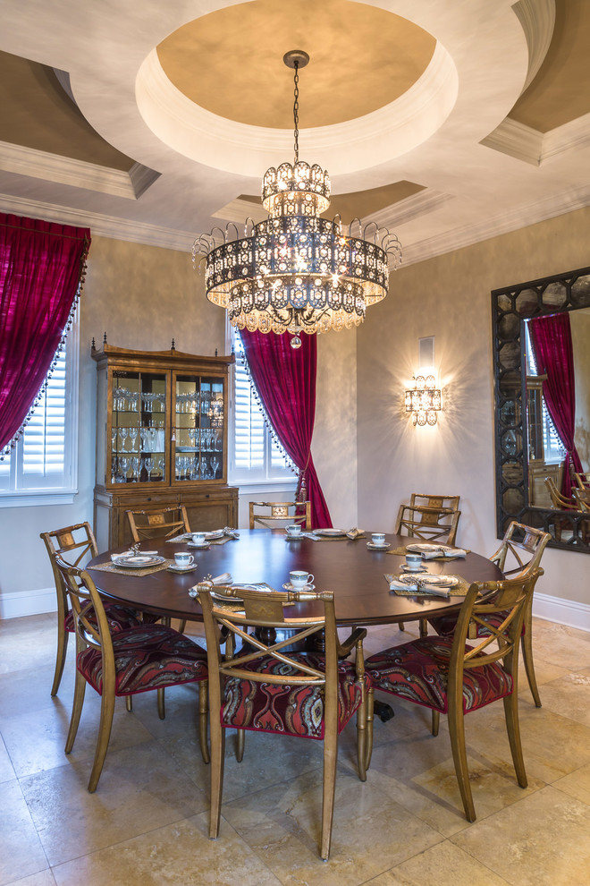 Photo of a mediterranean dining room in Miami with beige walls.