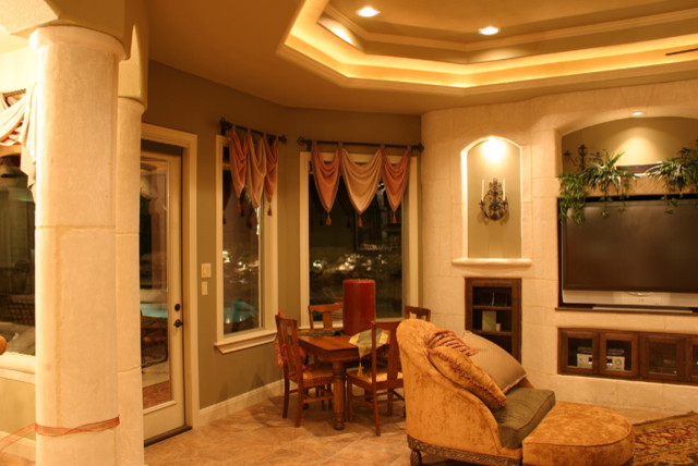 Example of a tuscan dining room design in Austin