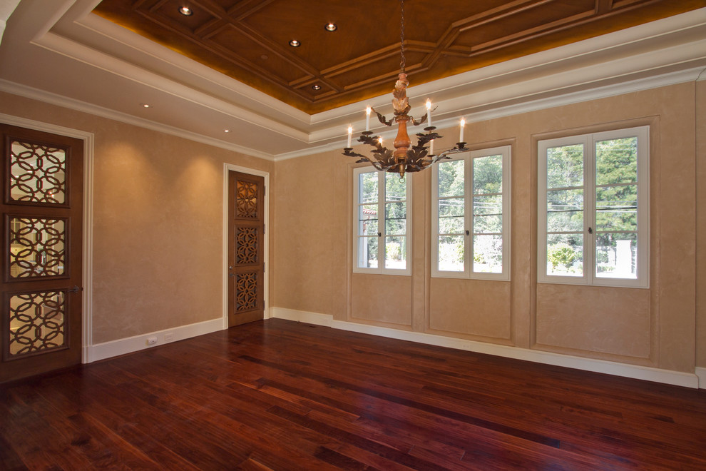 Photo of an expansive mediterranean enclosed dining room in San Francisco with beige walls and dark hardwood flooring.