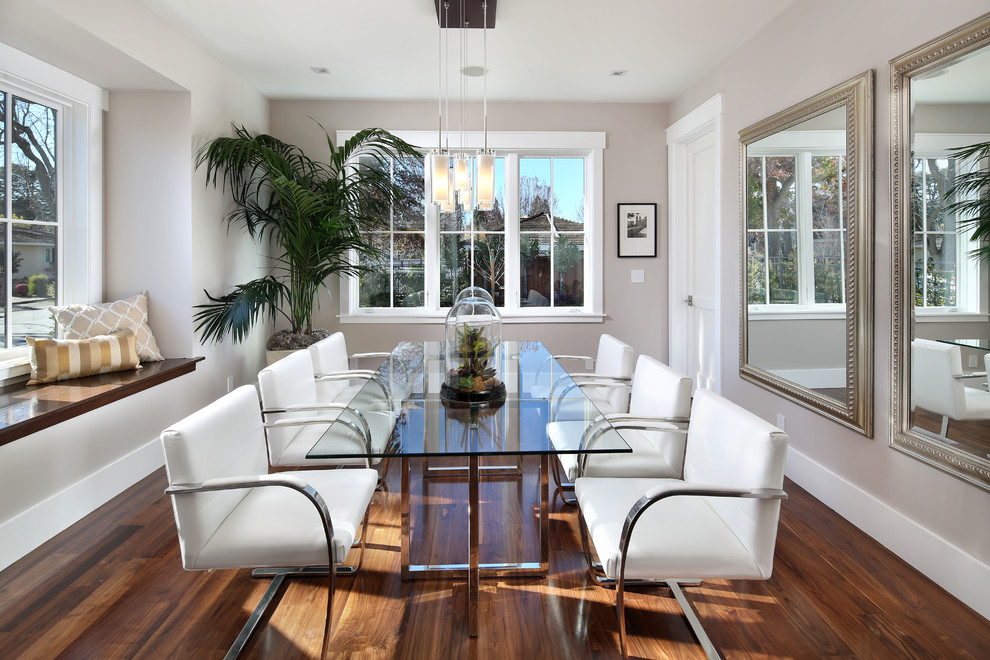 Large elegant medium tone wood floor enclosed dining room photo in San Francisco with gray walls