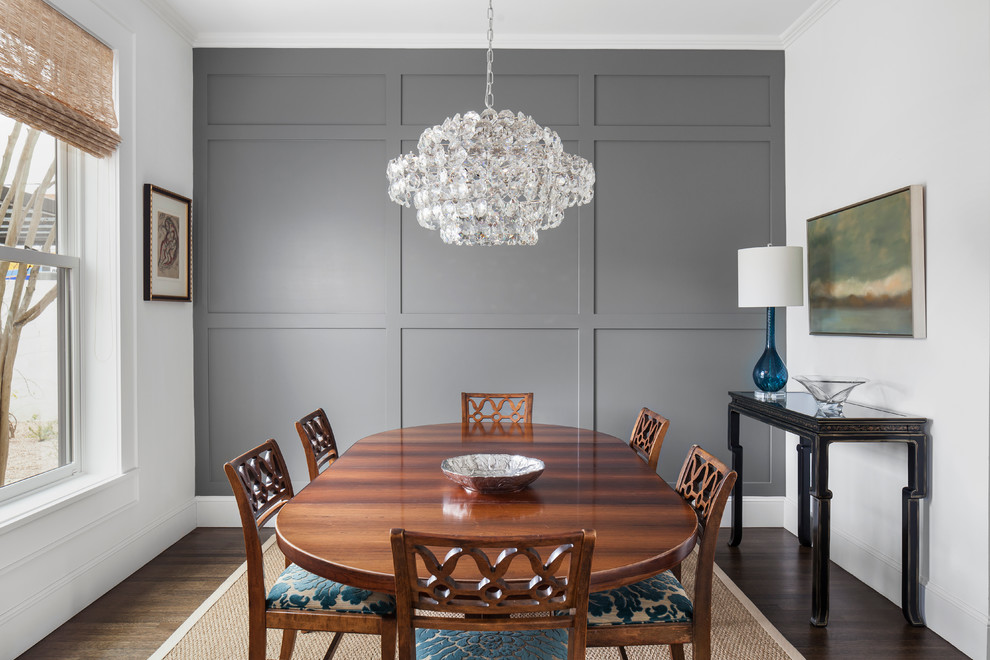 Classic dining room in Austin with grey walls, dark hardwood flooring, no fireplace and feature lighting.
