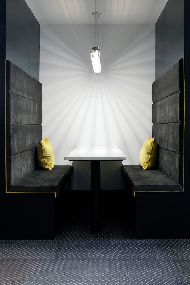 Photo of a contemporary dining room in Dublin with black walls.