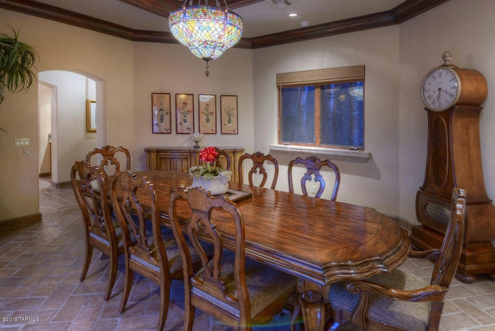 Photo of a medium sized traditional enclosed dining room in Phoenix with beige walls and terracotta flooring.
