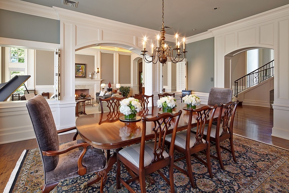 Enclosed dining room - traditional dark wood floor and brown floor enclosed dining room idea in Seattle with gray walls