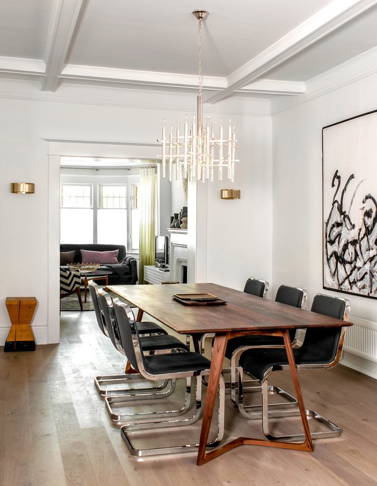 Photo of a contemporary dining room in Toronto with white walls.