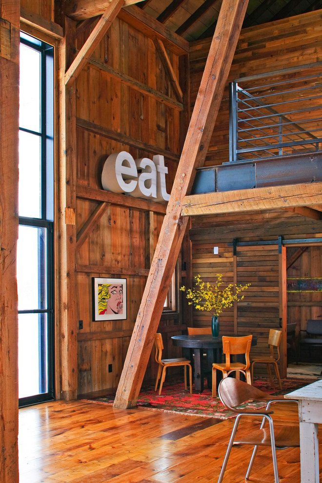 Inspiration for a rustic open plan dining room in Detroit with no fireplace.