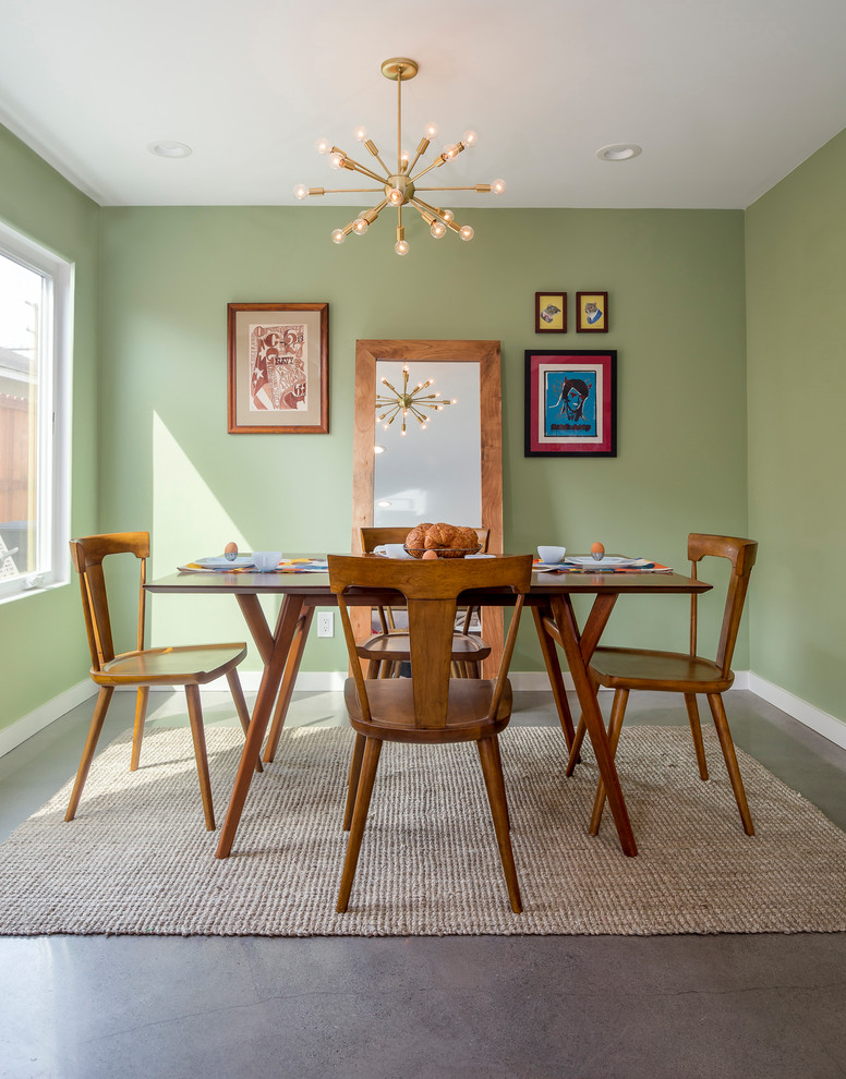 Inspiration for a small 1960s concrete floor and gray floor dining room remodel in Los Angeles with green walls and no fireplace