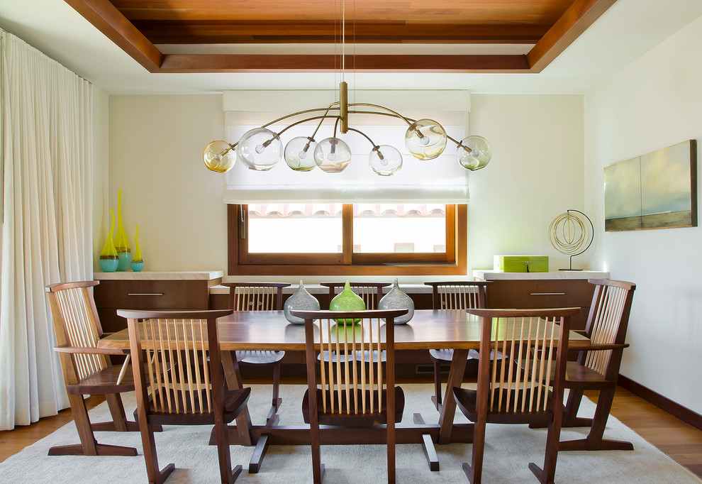 Inspiration for a beach style dining room in Los Angeles with white walls.