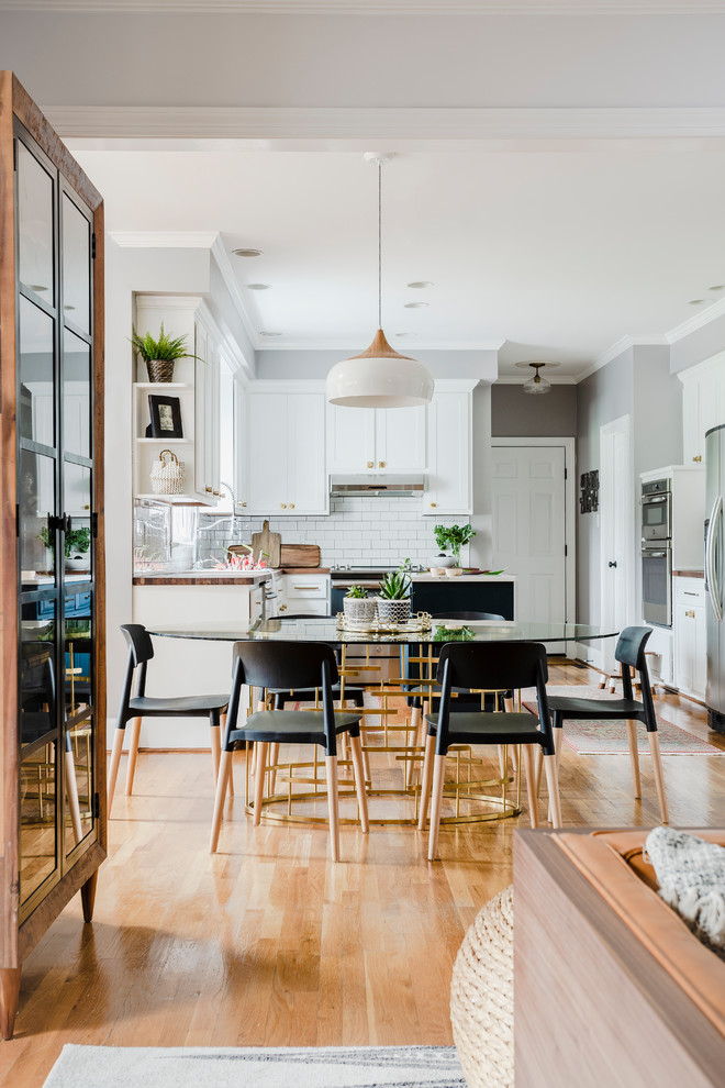 Inspiration for a traditional open plan dining room in Richmond with grey walls, medium hardwood flooring and brown floors.