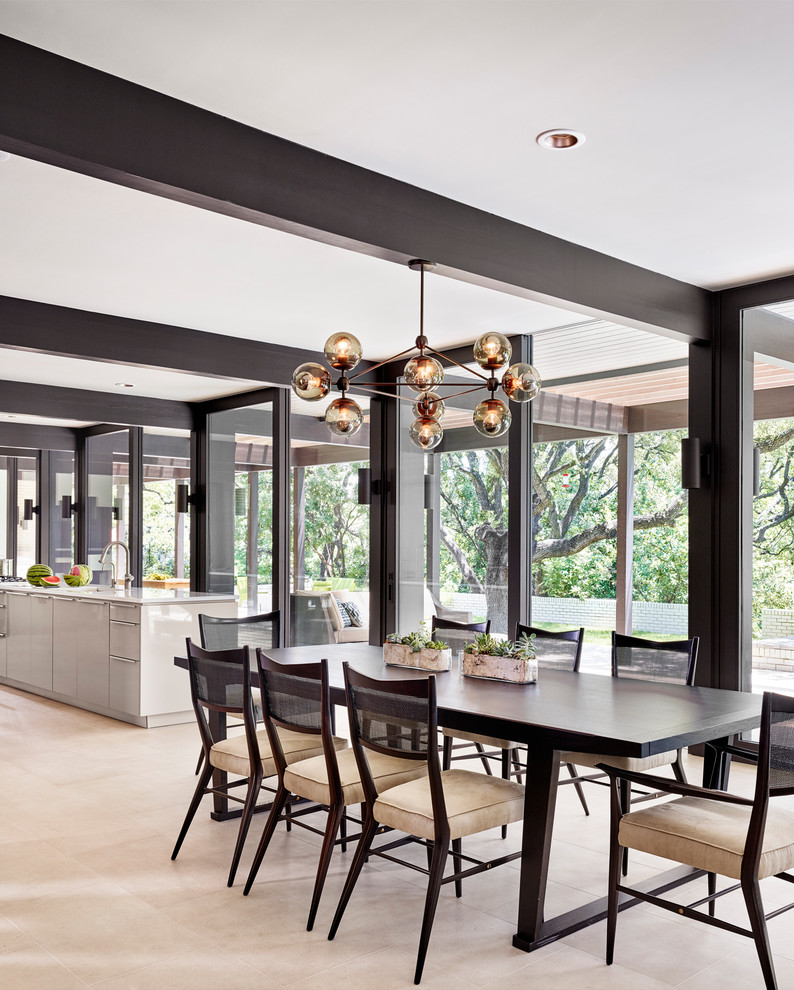 Photo of a large contemporary kitchen/dining room in Austin with limestone flooring, no fireplace, white walls and beige floors.