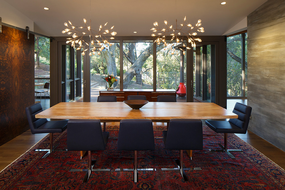 Inspiration for a mid-sized mid-century modern dark wood floor enclosed dining room remodel in San Francisco with white walls